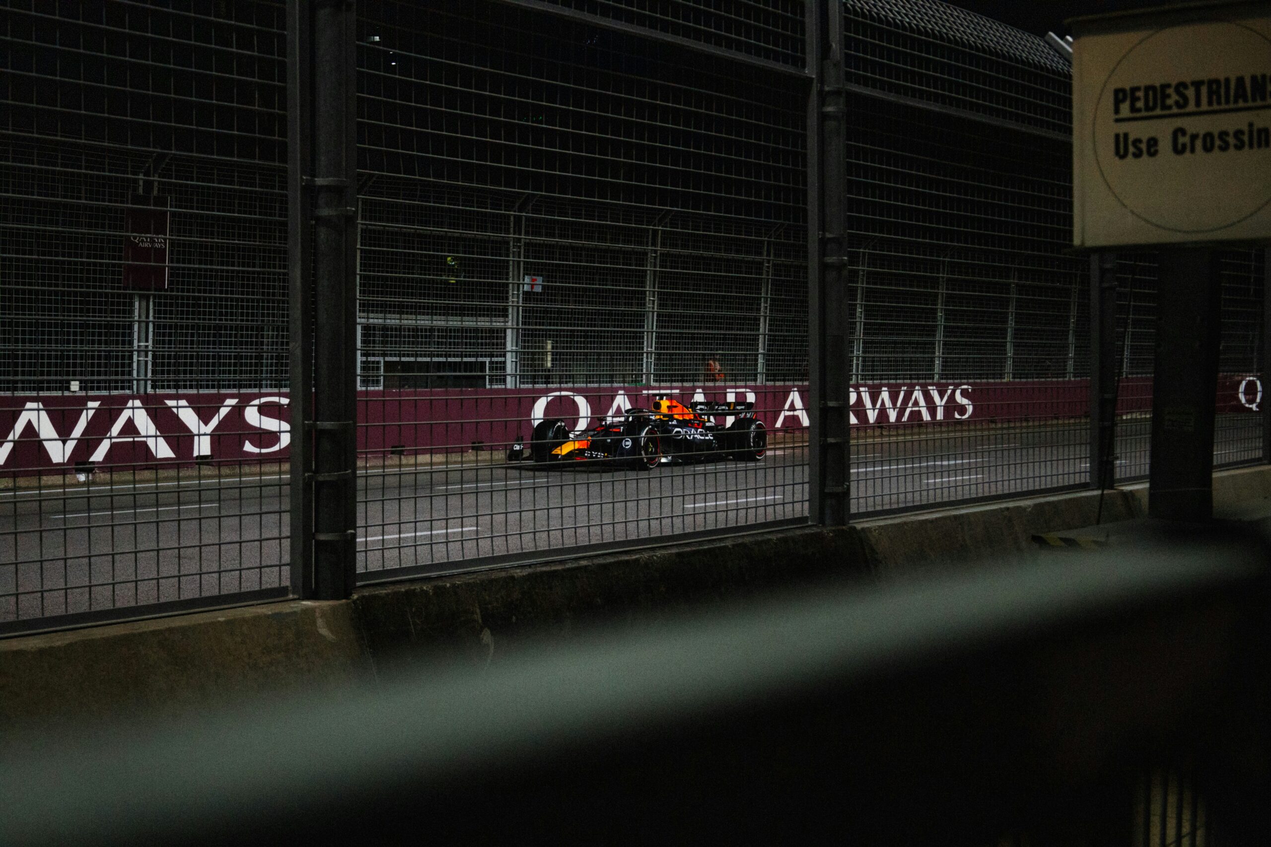 A Formula 1 race car on a track at night